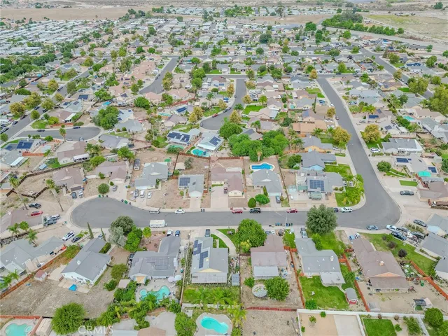 an aerial view of residential houses with outdoor space