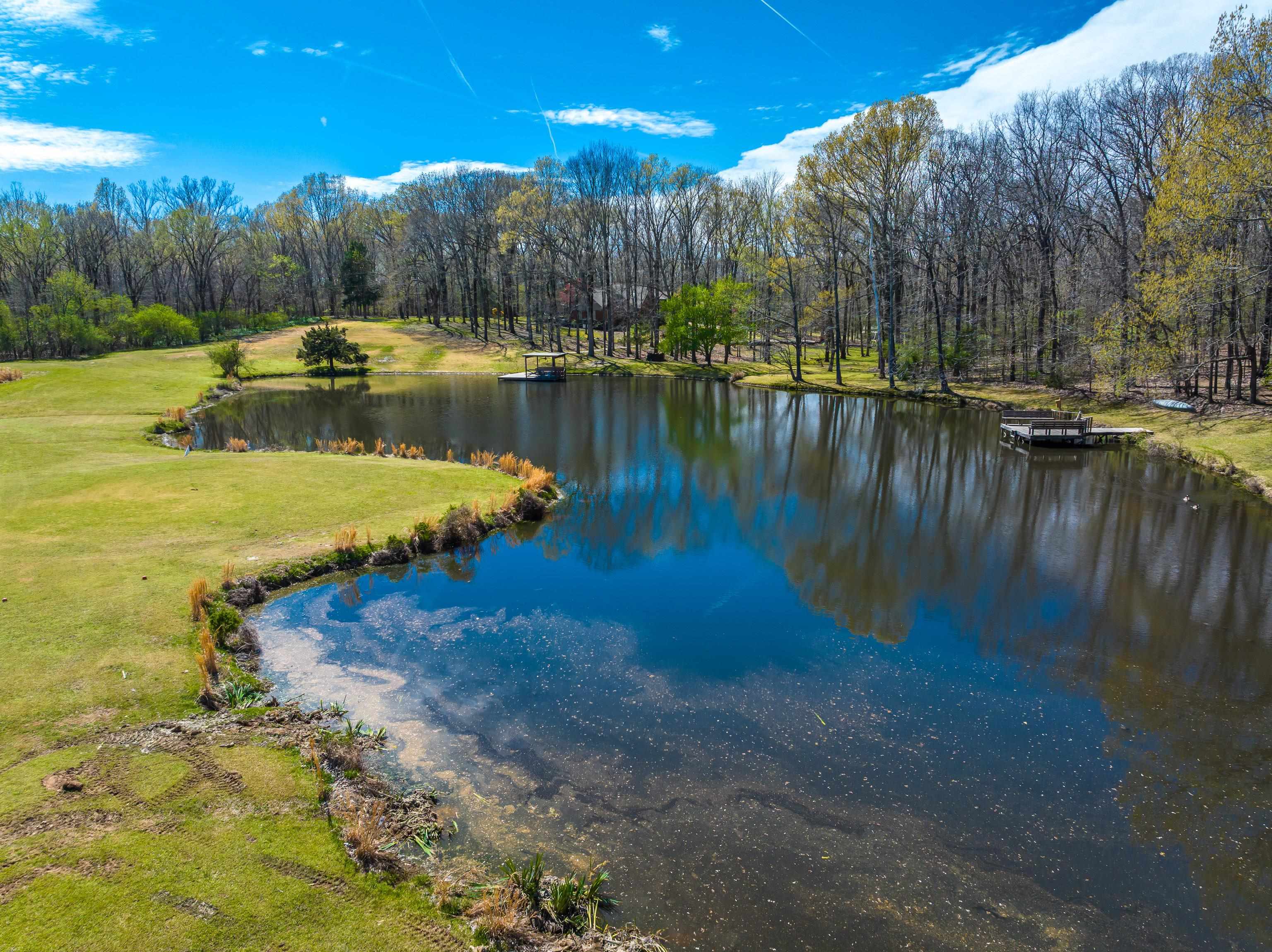 9155 Rocky Cannon Road Memphis, TN 38018 - Photo 16 of 20 a view of a lake with houses with outdoor space