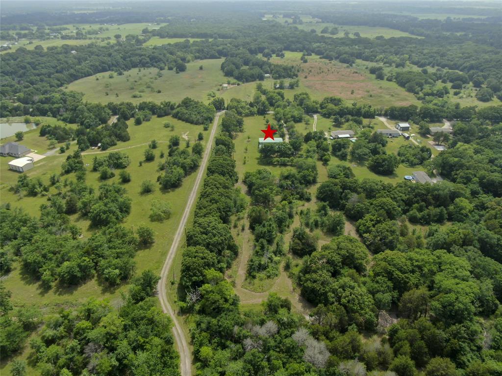 10476 County Road 313 Terrell, TX 75161 - Photo 38 of 40 an aerial view of residential houses with outdoor space and trees
