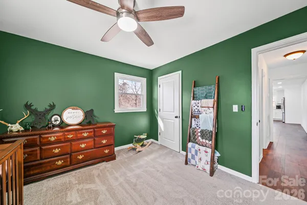 a bed room with a bed and a mirror