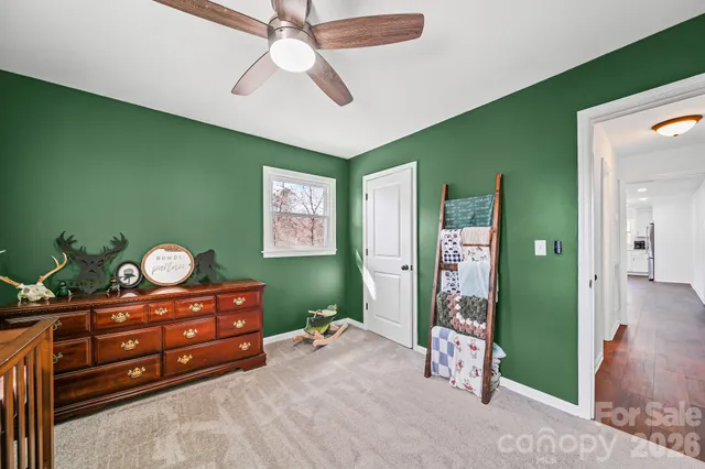 a bed room with a bed and a mirror