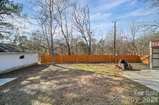 a view of a backyard of the house