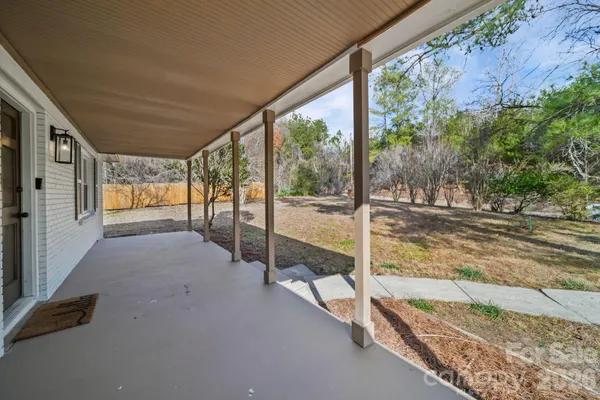 a view of a porch and garden
