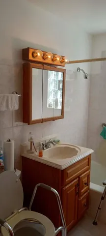 a room with a sink and a mirror