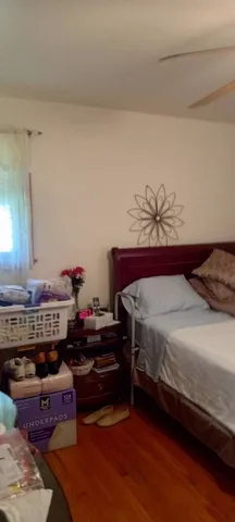 a bedroom with a bed and a dresser