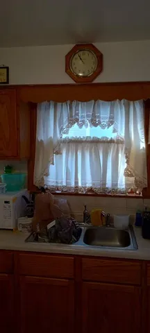 a kitchen with a stove and cabinets