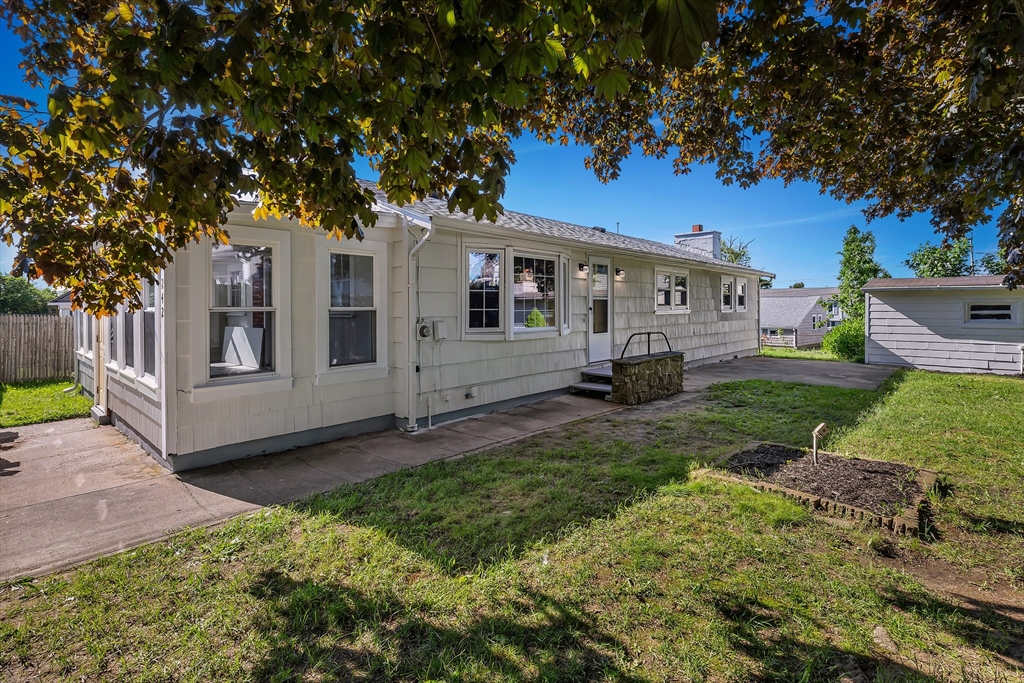242 Welcome Street Fall River, MA 02721 - Photo 1 of 21 a view of a house with a yard