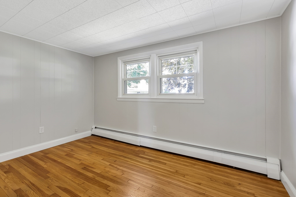 242 Welcome Street Fall River, MA 02721 - Photo 12 of 21 a view of an empty room with wooden floor and a window