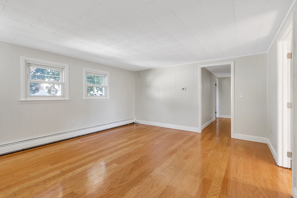 242 Welcome Street Fall River, MA 02721 - Photo 15 of 21 a view of an empty room with wooden floor and a window