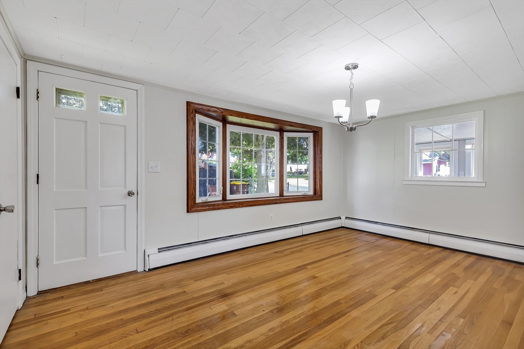 242 Welcome Street Fall River, MA 02721 - Photo 5 of 21 a view of an empty room with wooden floor and a window