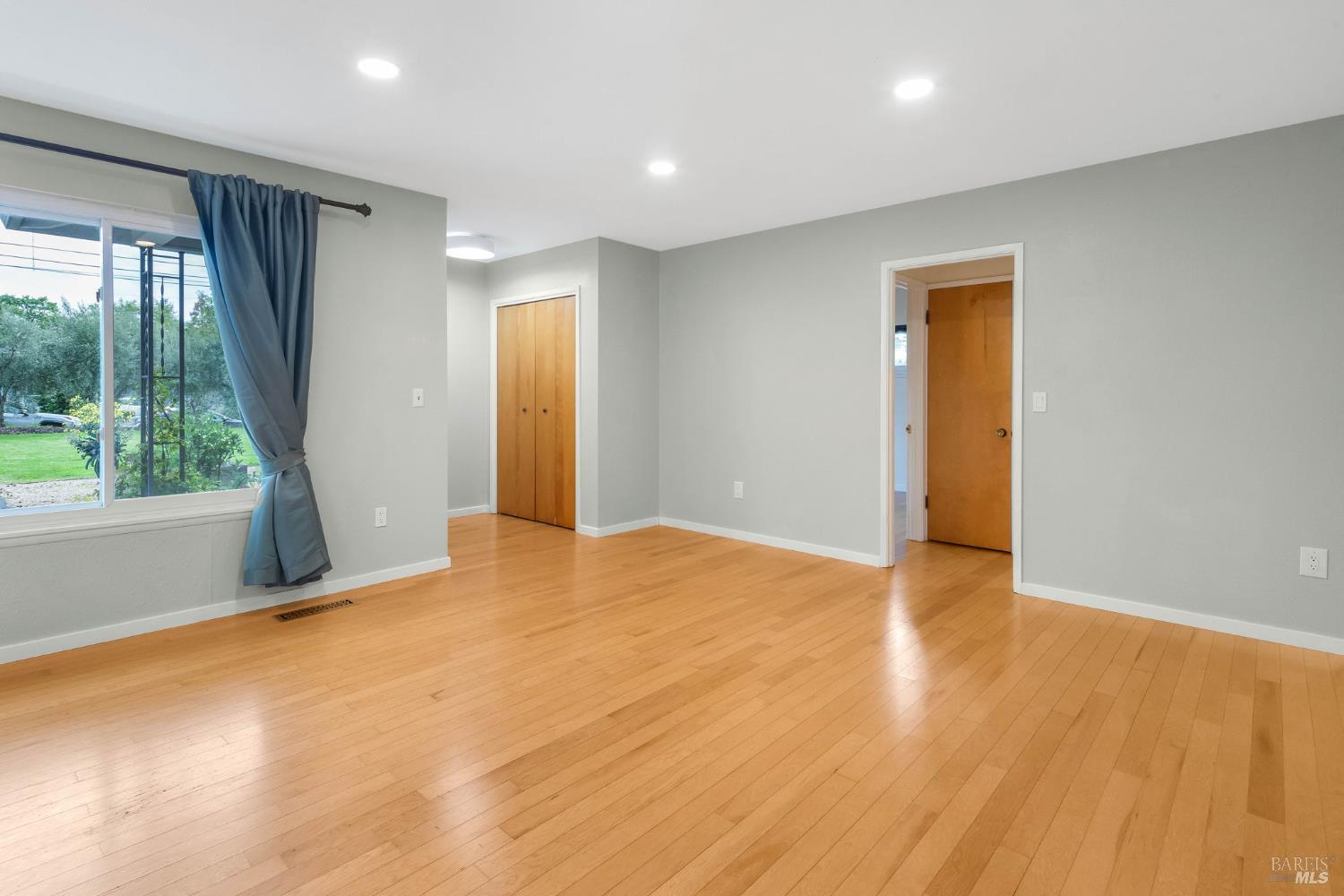 350 Newton Way Angwin, CA 94508 - Photo 11 of 44 a view of empty room with wooden floor and fan