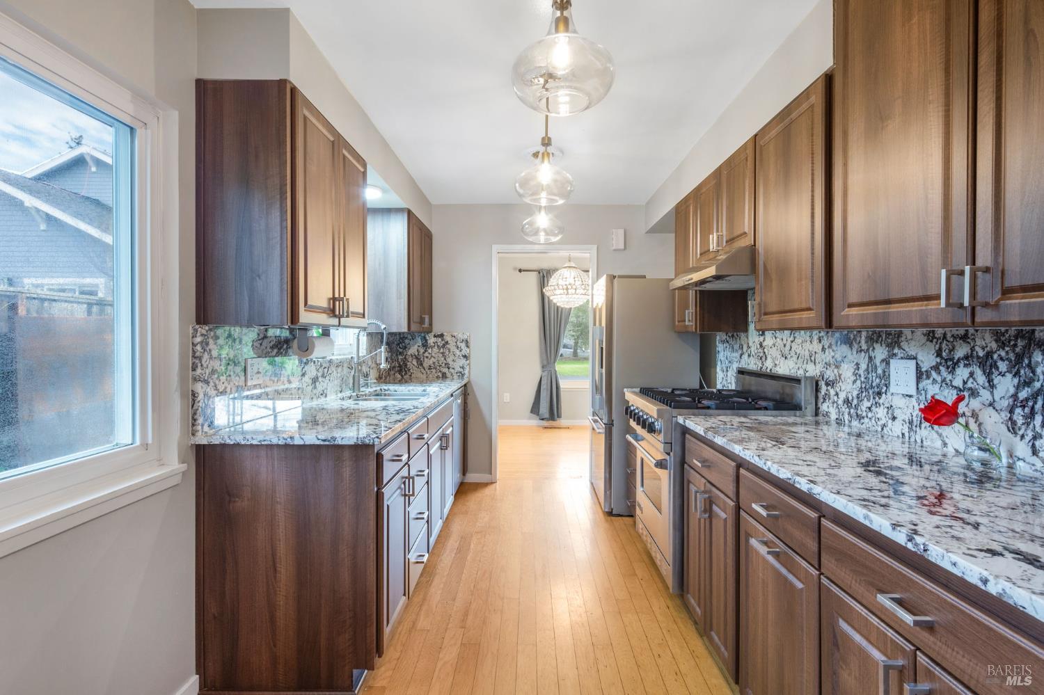 350 Newton Way Angwin, CA 94508 - Photo 18 of 44 a kitchen with stainless steel appliances granite countertop a sink stove and refrigerator