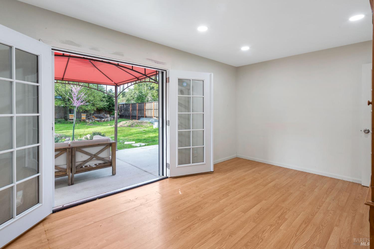 350 Newton Way Angwin, CA 94508 - Photo 25 of 44 an empty room with wooden floor and windows