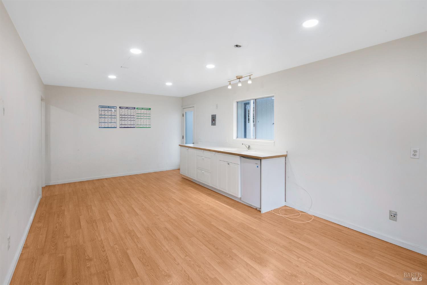 350 Newton Way Angwin, CA 94508 - Photo 27 of 44 a view of an empty room with wooden floor and a window