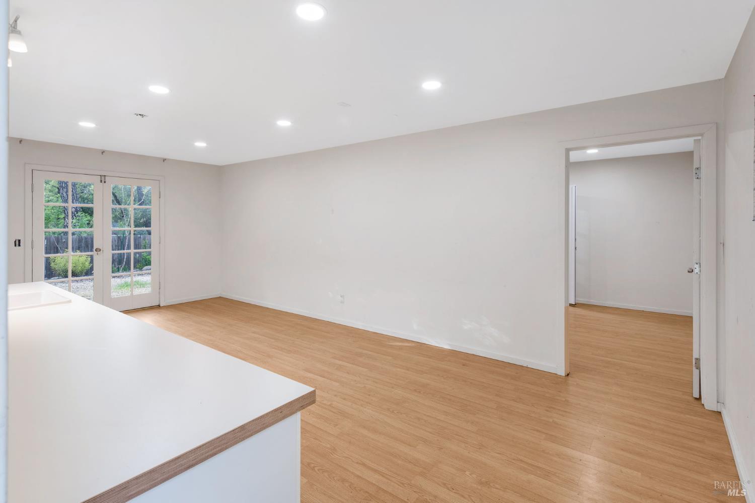 350 Newton Way Angwin, CA 94508 - Photo 28 of 44 a view of an empty room with wooden floor and a window