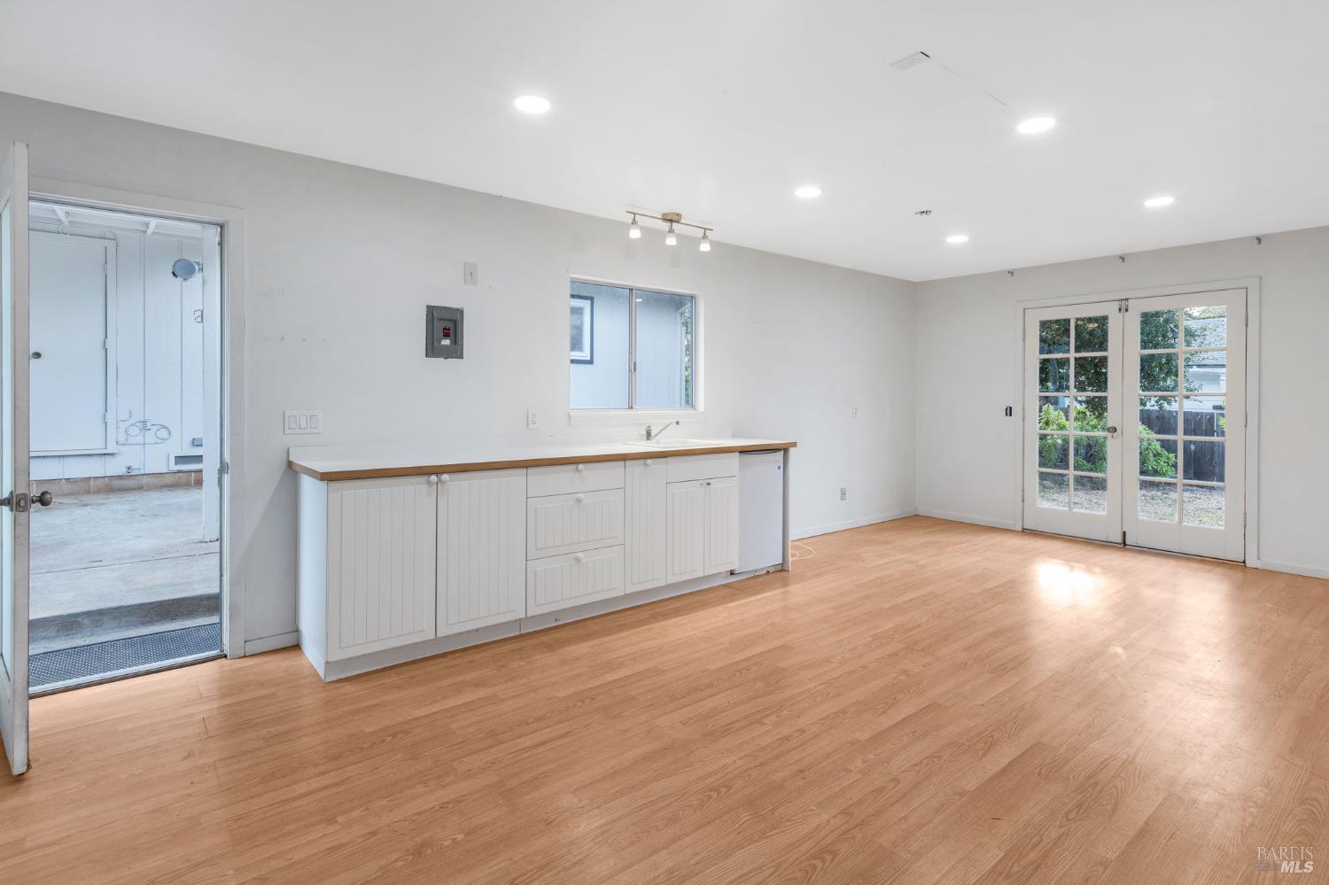 350 Newton Way Angwin, CA 94508 - Photo 29 of 44 an empty room with wooden floor and windows