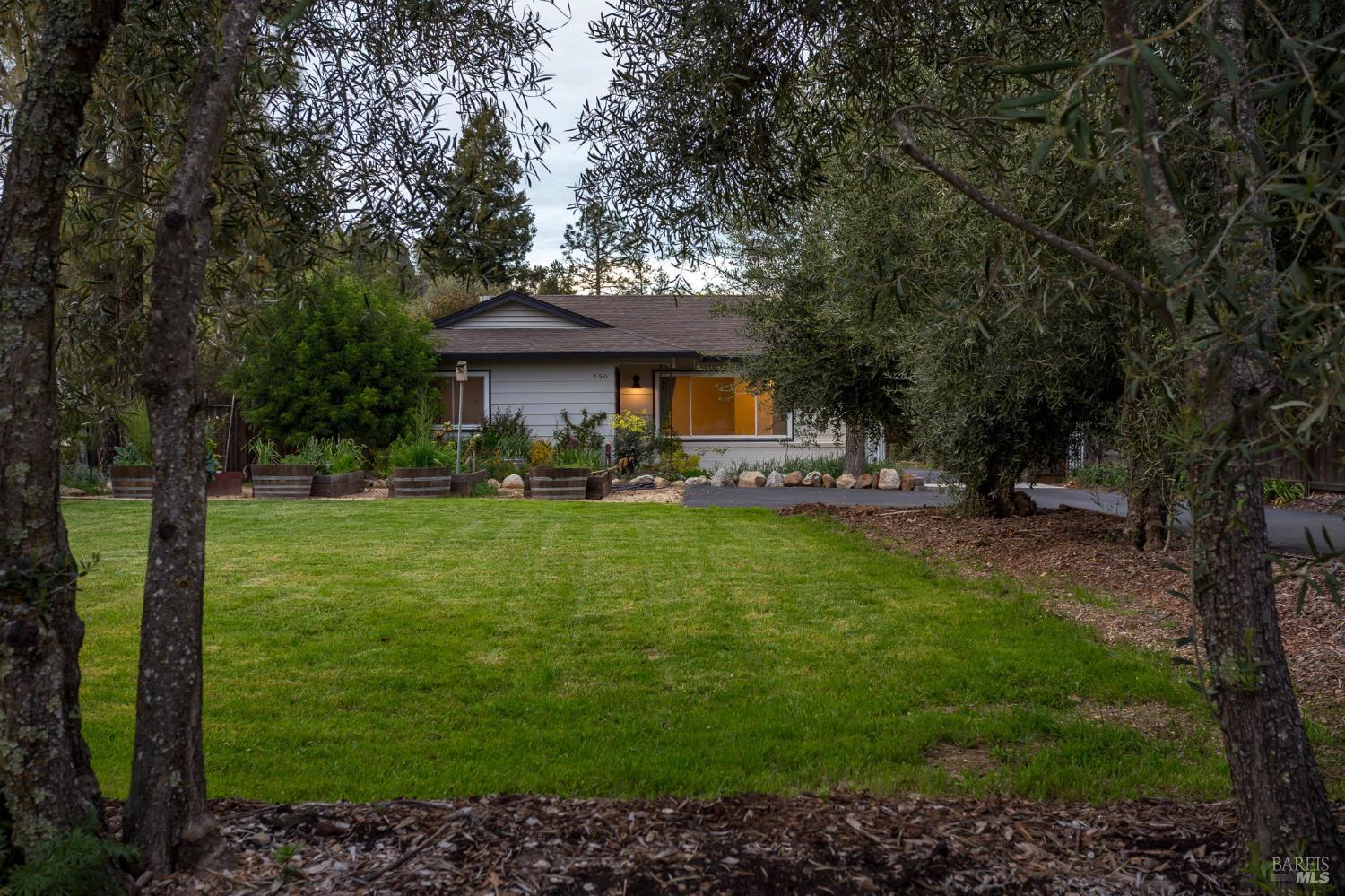 350 Newton Way Angwin, CA 94508 - Photo 3 of 44 a front view of a house with garden
