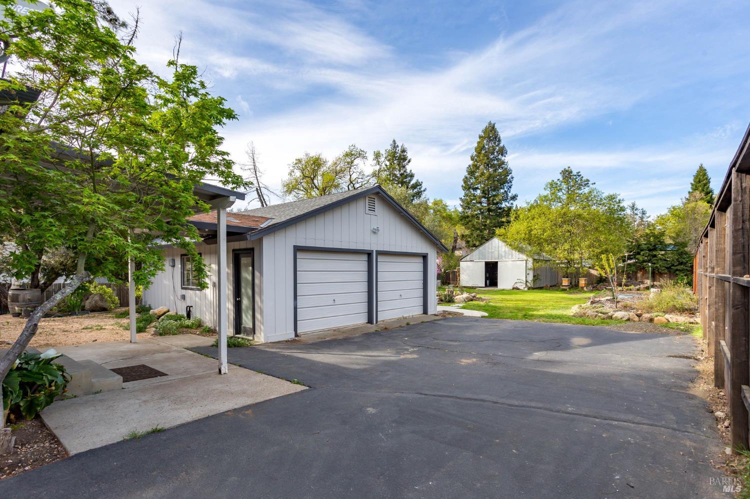 350 Newton Way Angwin, CA 94508 - Photo 31 of 44 a view of a house with a yard and large trees