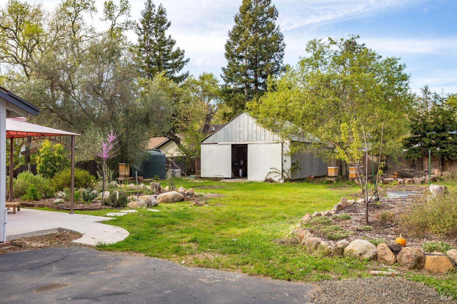 350 Newton Way Angwin, CA 94508 - Photo 32 of 44 a front view of a house with garden