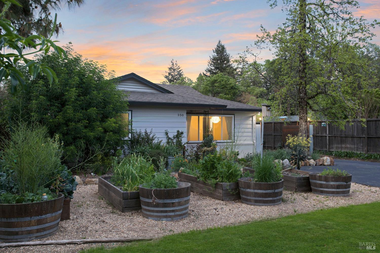350 Newton Way Angwin, CA 94508 - Photo 4 of 44 a view of a backyard with potted plants and a fountain