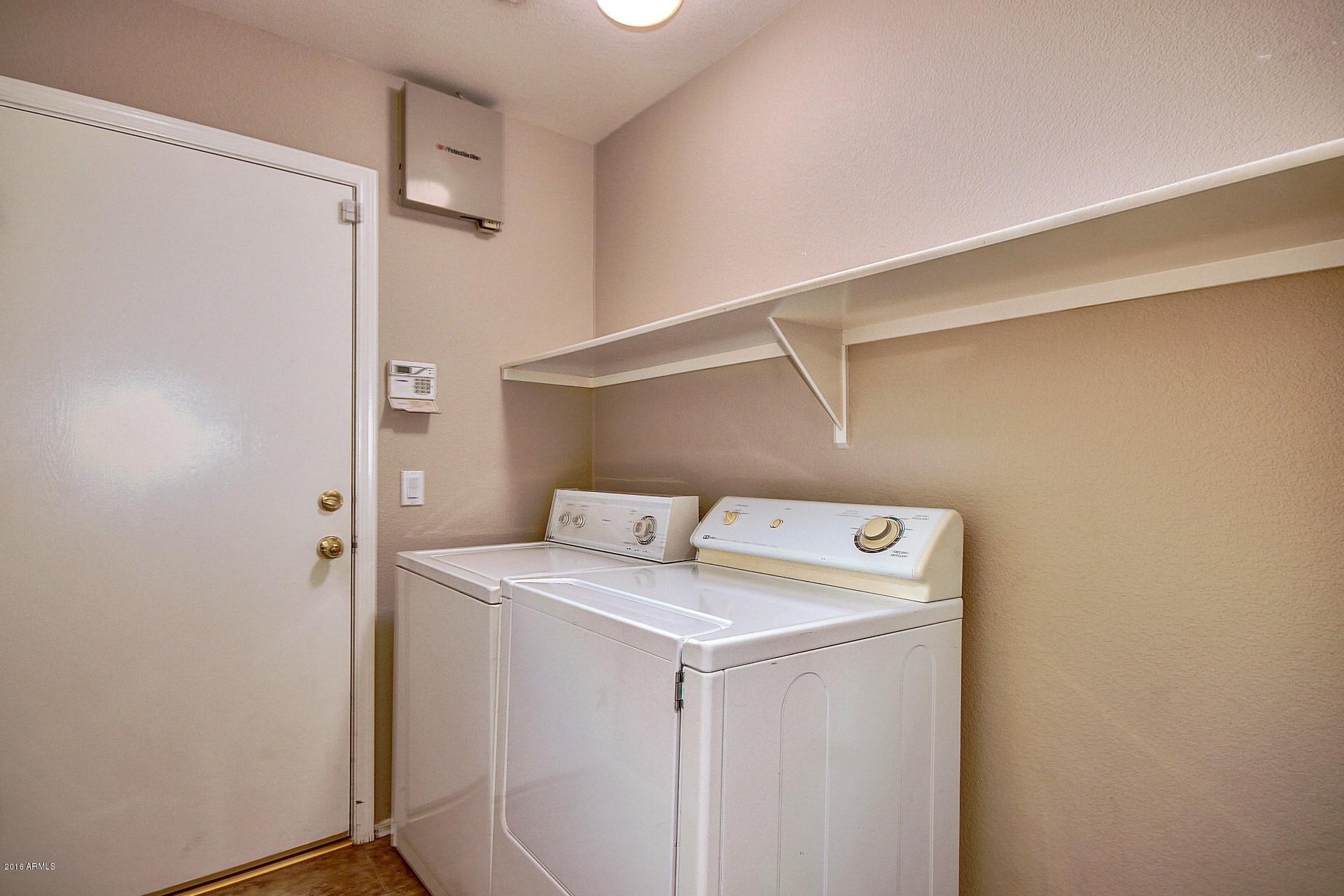 16056 South 18th Avenue Phoenix, AZ 85045 - Photo 17 of 37 a utility room with dryer and washer