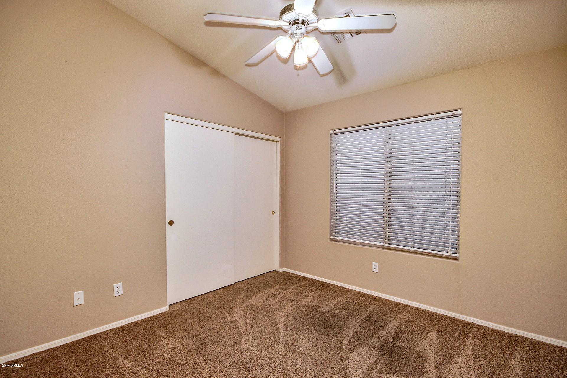 16056 South 18th Avenue Phoenix, AZ 85045 - Photo 19 of 37 a view of an empty room with a window