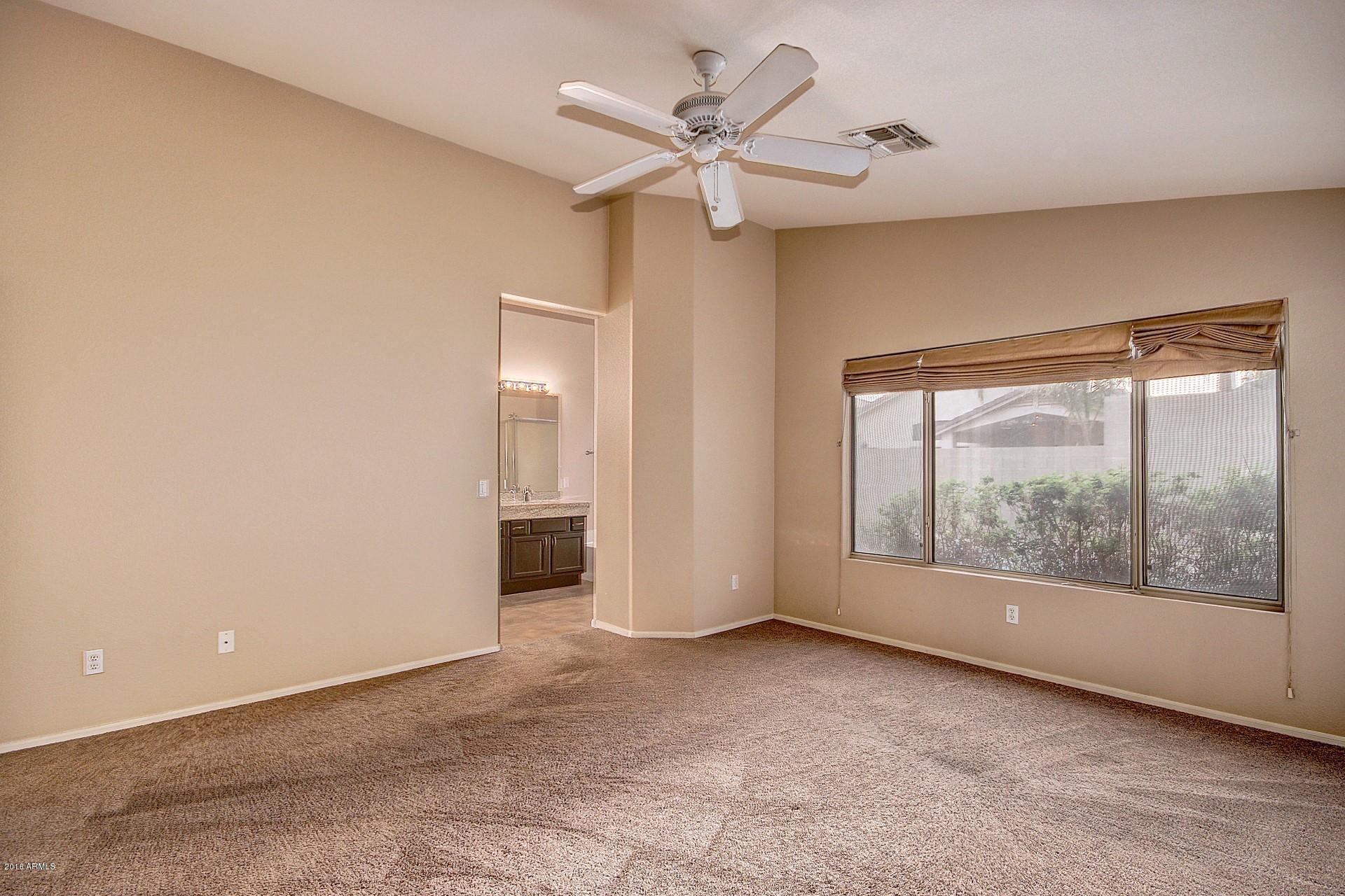 16056 South 18th Avenue Phoenix, AZ 85045 - Photo 21 of 37 a view of an empty room with a window