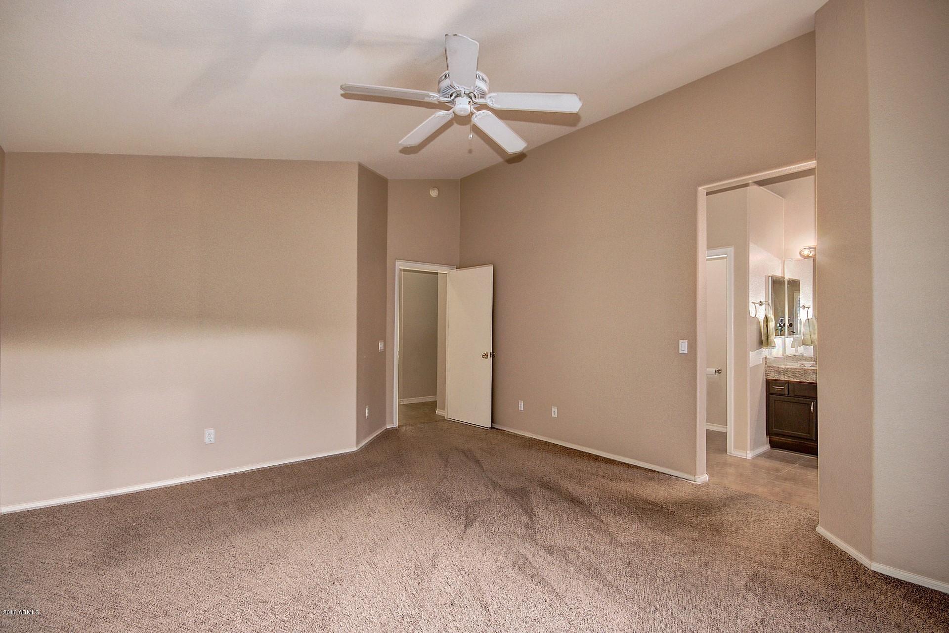 16056 South 18th Avenue Phoenix, AZ 85045 - Photo 24 of 37 a view of a room with a ceiling fan
