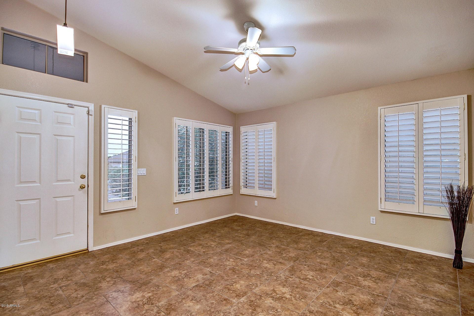 16056 South 18th Avenue Phoenix, AZ 85045 - Photo 4 of 37 a view of an empty room with a window