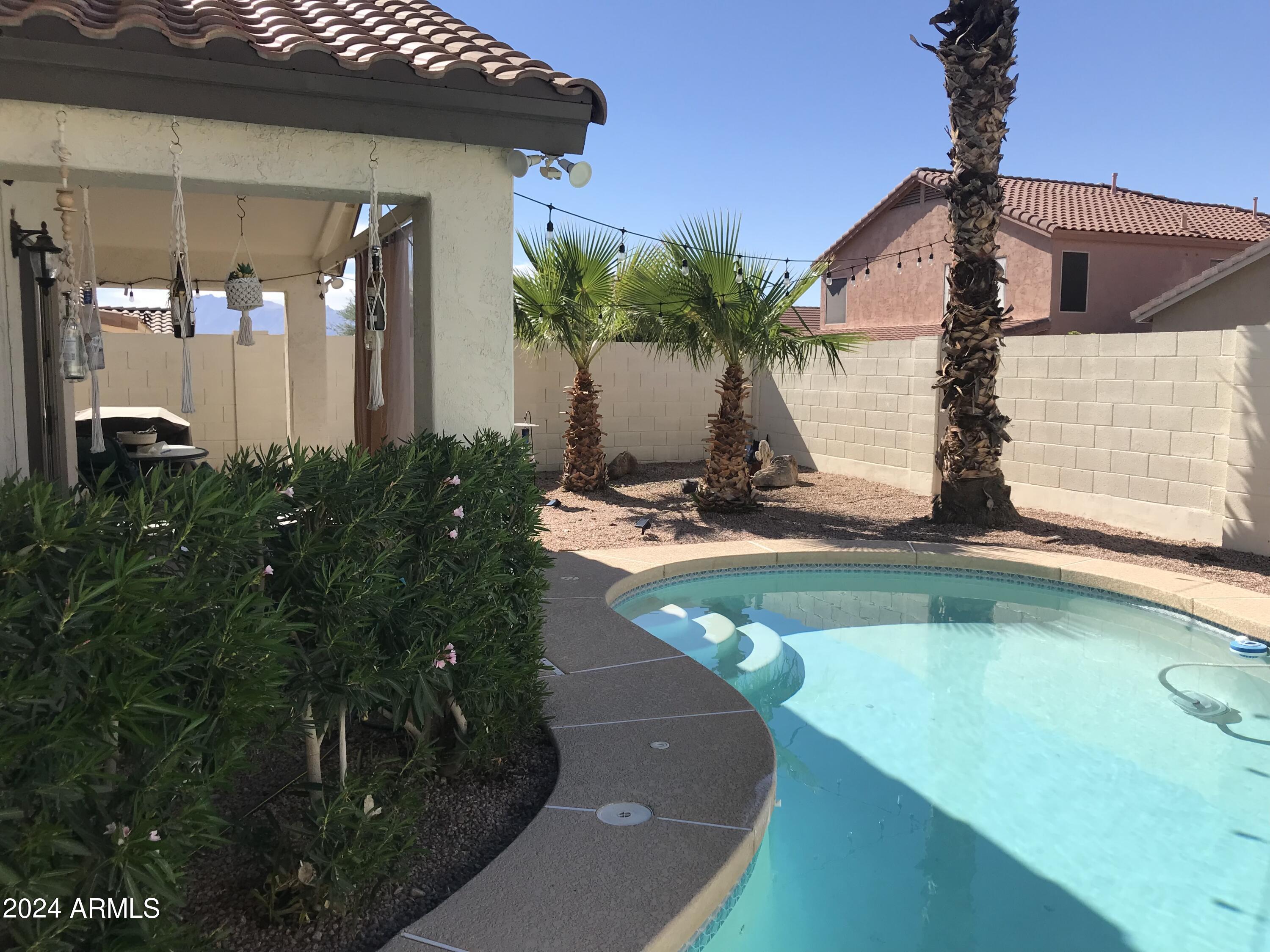 16056 South 18th Avenue Phoenix, AZ 85045 - Photo 7 of 37 a view of a house with pool