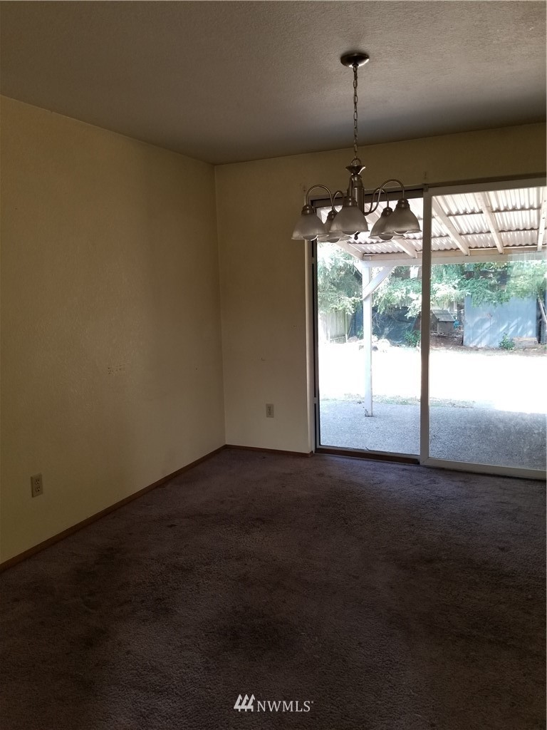 8731 Hawks Glen Loop Southeast Olympia, WA 98513 - Photo 3 of 15 an empty room with a window