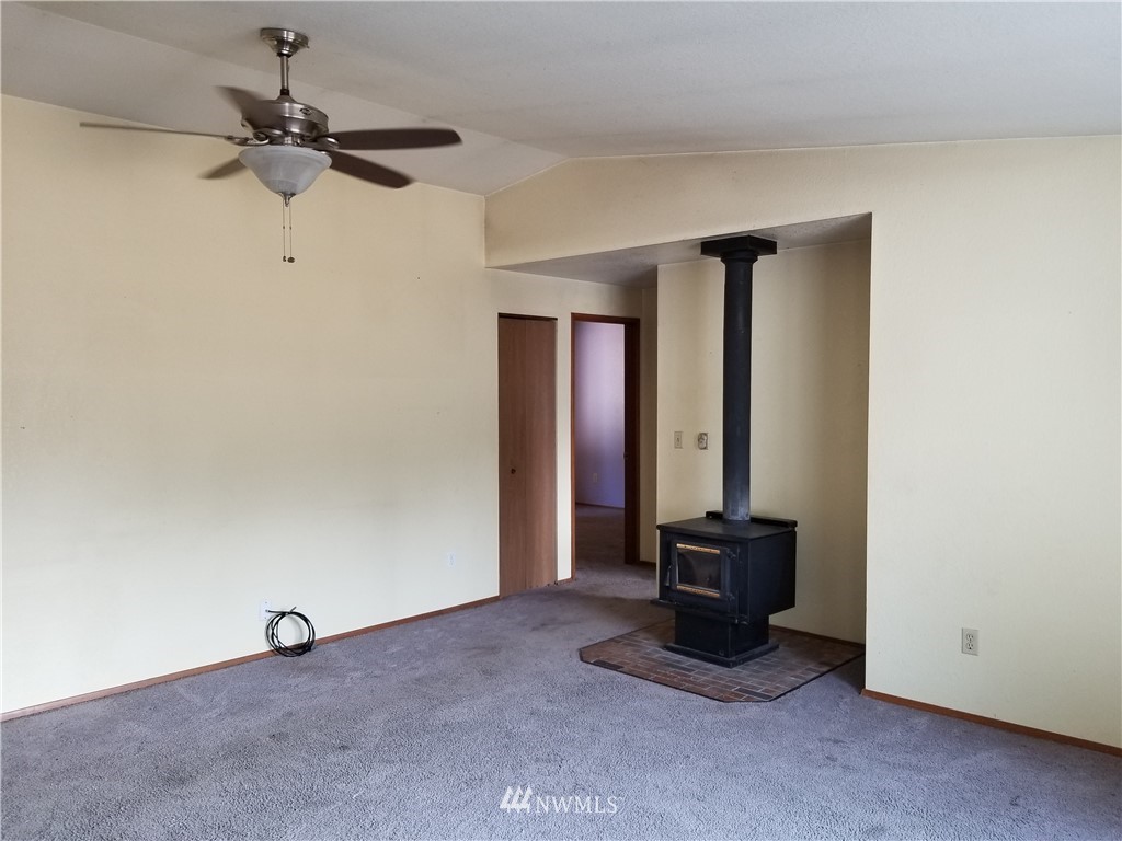 8731 Hawks Glen Loop Southeast Olympia, WA 98513 - Photo 4 of 15 a view of a room with a ceiling fan