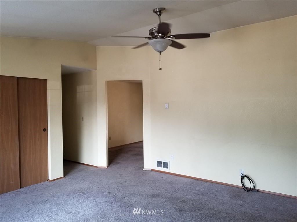 8731 Hawks Glen Loop Southeast Olympia, WA 98513 - Photo 5 of 15 a view of a room with a ceiling fan