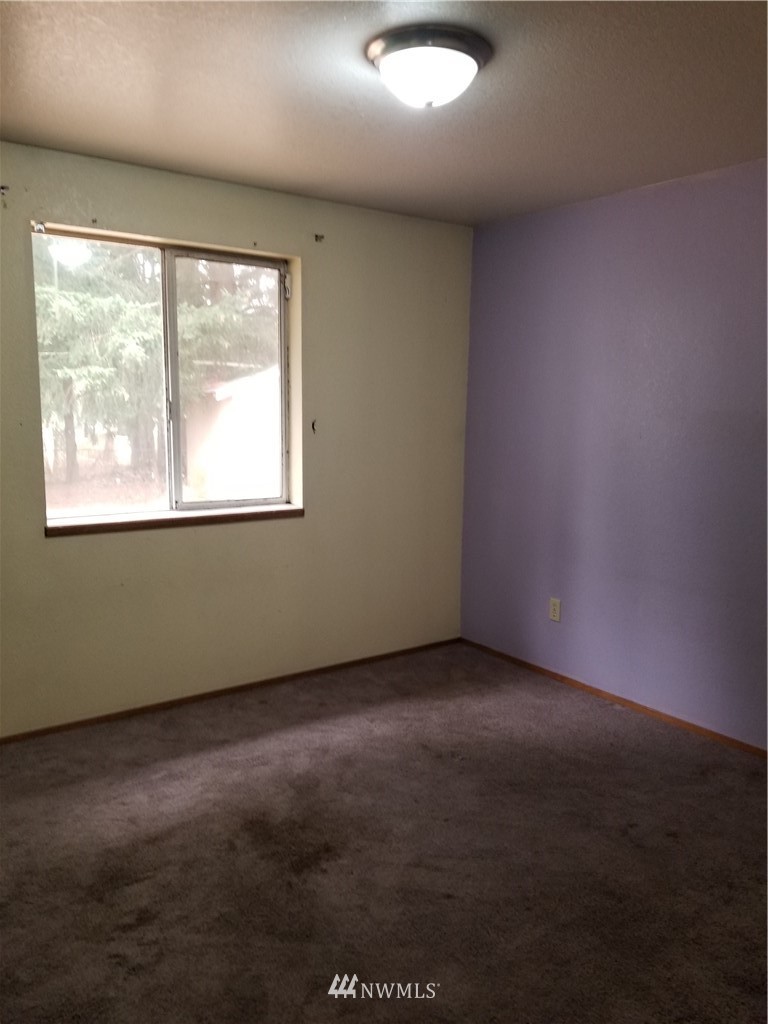 8731 Hawks Glen Loop Southeast Olympia, WA 98513 - Photo 7 of 15 an empty room with a window