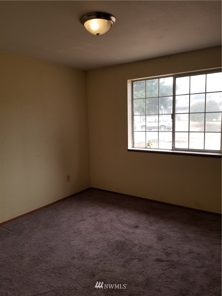 8731 Hawks Glen Loop Southeast Olympia, WA 98513 - Photo 8 of 15 an empty room with a window