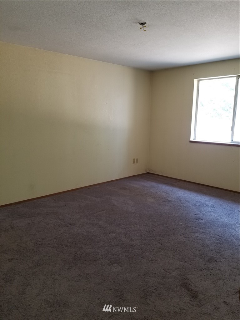 8731 Hawks Glen Loop Southeast Olympia, WA 98513 - Photo 9 of 15 an empty room with windows