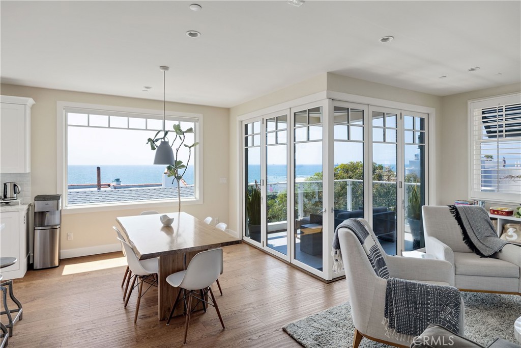 124 23rd Street Manhattan Beach, CA 90266 - Photo 11 of 46 a dining room with furniture a chandelier and wooden floor