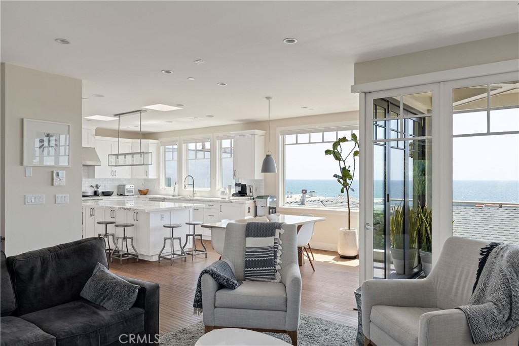 124 23rd Street Manhattan Beach, CA 90266 - Photo 12 of 46 a living room with furniture a large window and stainless steel appliances