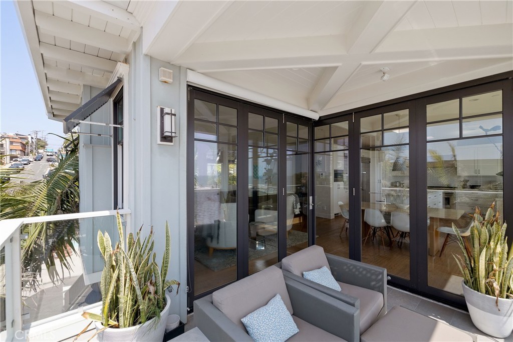 124 23rd Street Manhattan Beach, CA 90266 - Photo 20 of 46 a living room with furniture and a floor to ceiling window