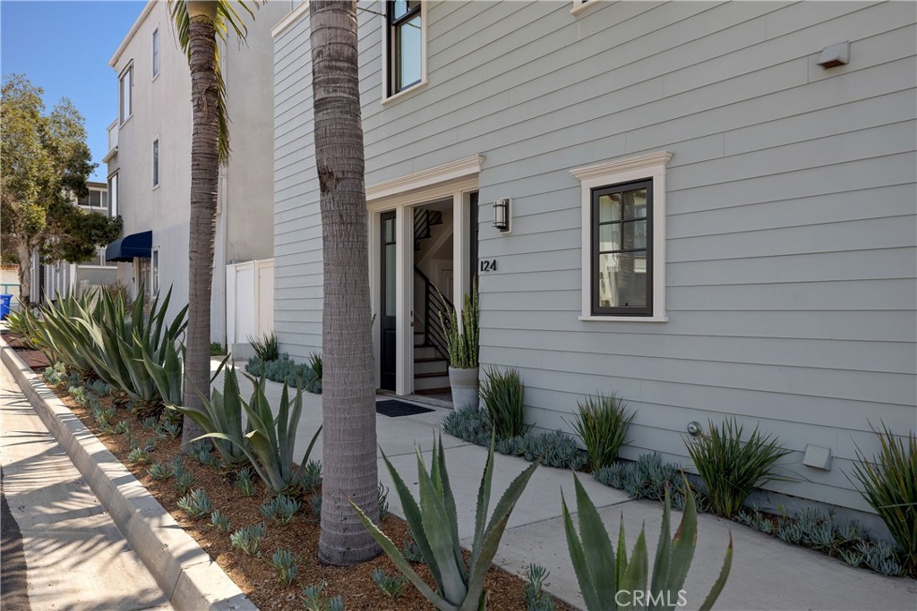 124 23rd Street Manhattan Beach, CA 90266 - Photo 2 of 46 a potted plant sitting in front of a house