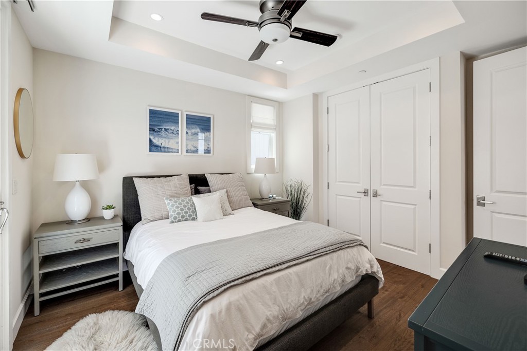 124 23rd Street Manhattan Beach, CA 90266 - Photo 42 of 46 a bedroom with a bed and a chandelier