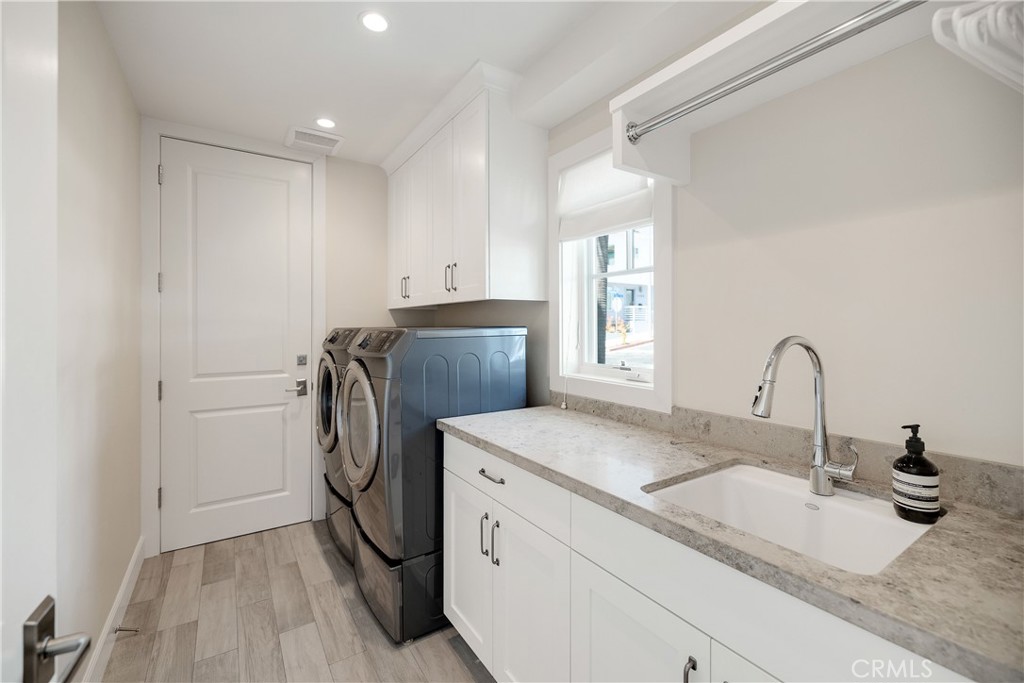 124 23rd Street Manhattan Beach, CA 90266 - Photo 46 of 46 a room with a sink a washer and dryer