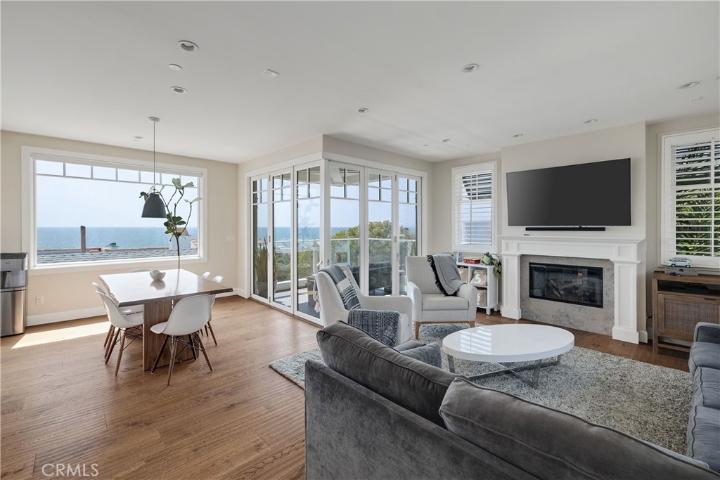 124 23rd Street Manhattan Beach, CA 90266 - Photo 10 of 46 a living room with furniture a fireplace and a flat screen tv