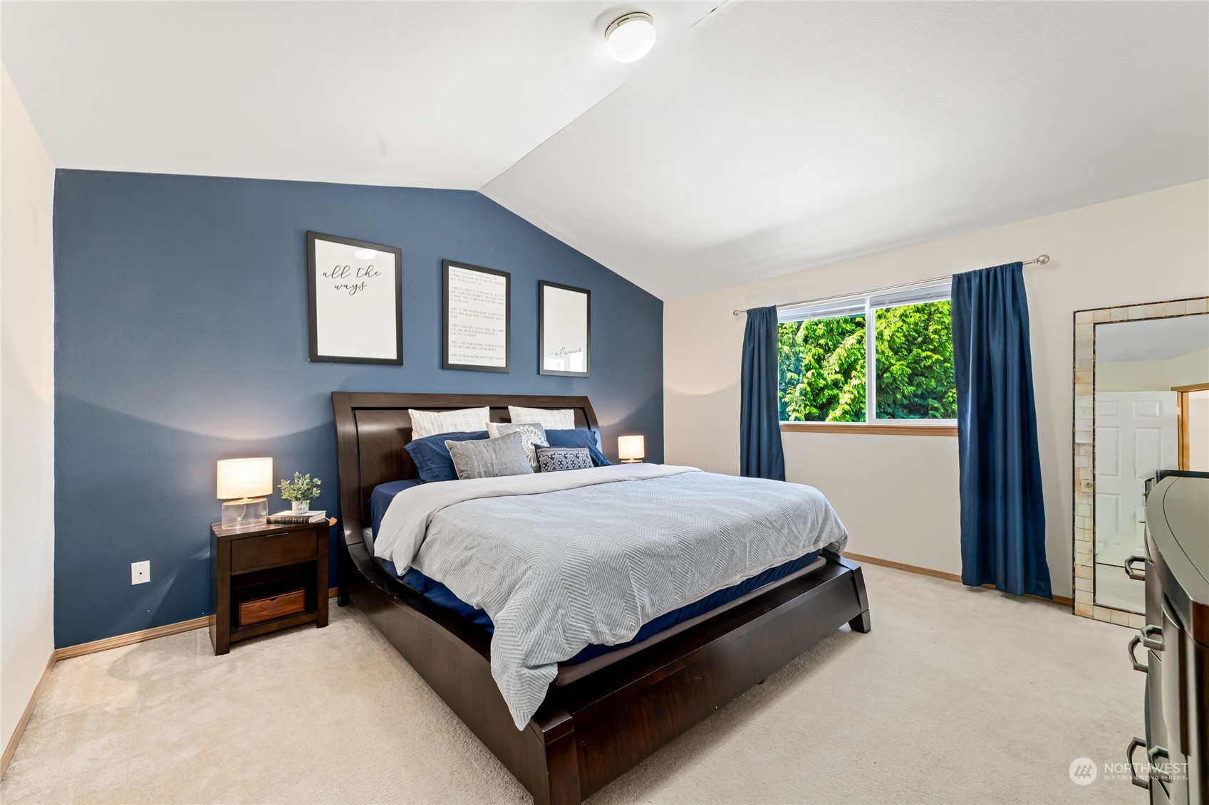 17716 8th Place West Bothell, WA 98012 - Photo 11 of 27 a bed sitting in a bedroom next to a window