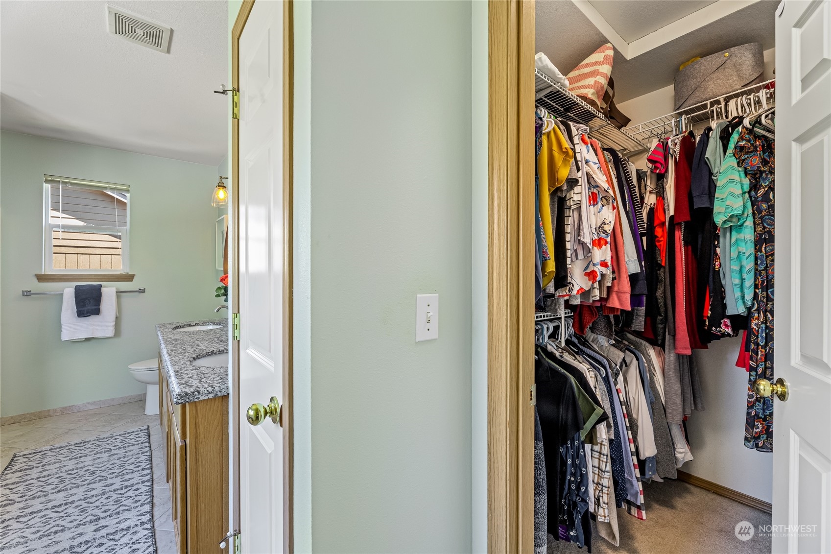 17716 8th Place West Bothell, WA 98012 - Photo 15 of 27 a view of walk in closet with clothes