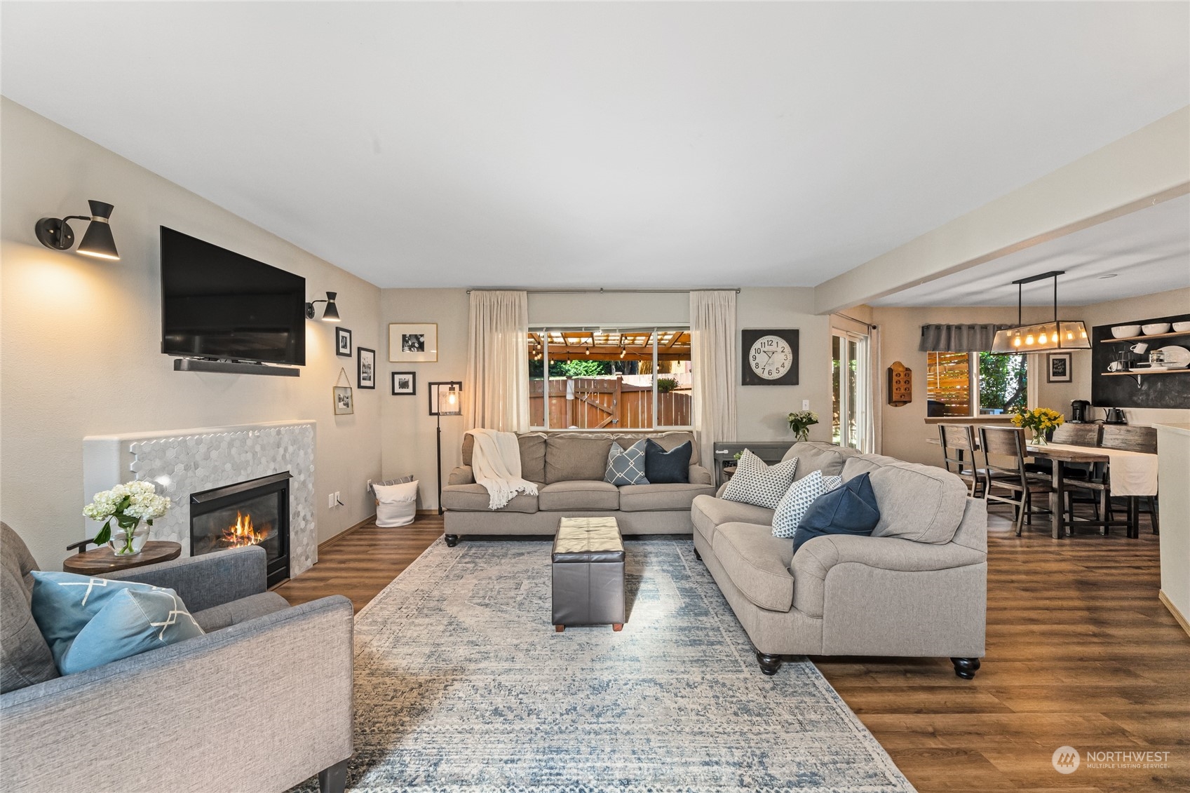 17716 8th Place West Bothell, WA 98012 - Photo 4 of 27 a living room with furniture a fireplace and a flat screen tv