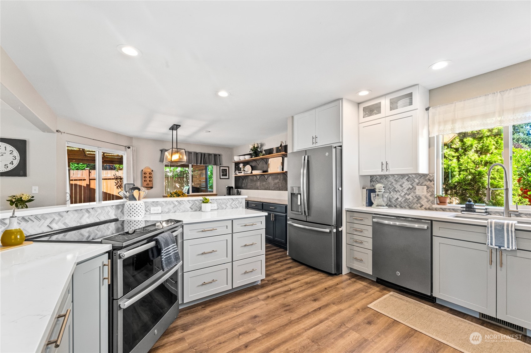 17716 8th Place West Bothell, WA 98012 - Photo 5 of 27 a kitchen with stainless steel appliances granite countertop a stove and a refrigerator