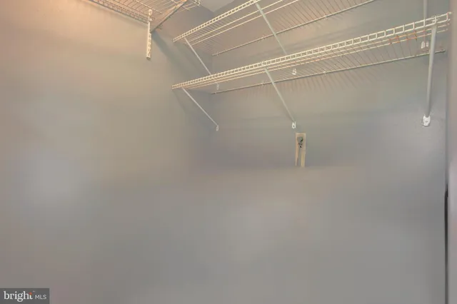 a view of a room with racks on the wall