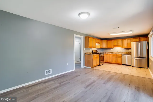 a view of a kitchen with wooden floor