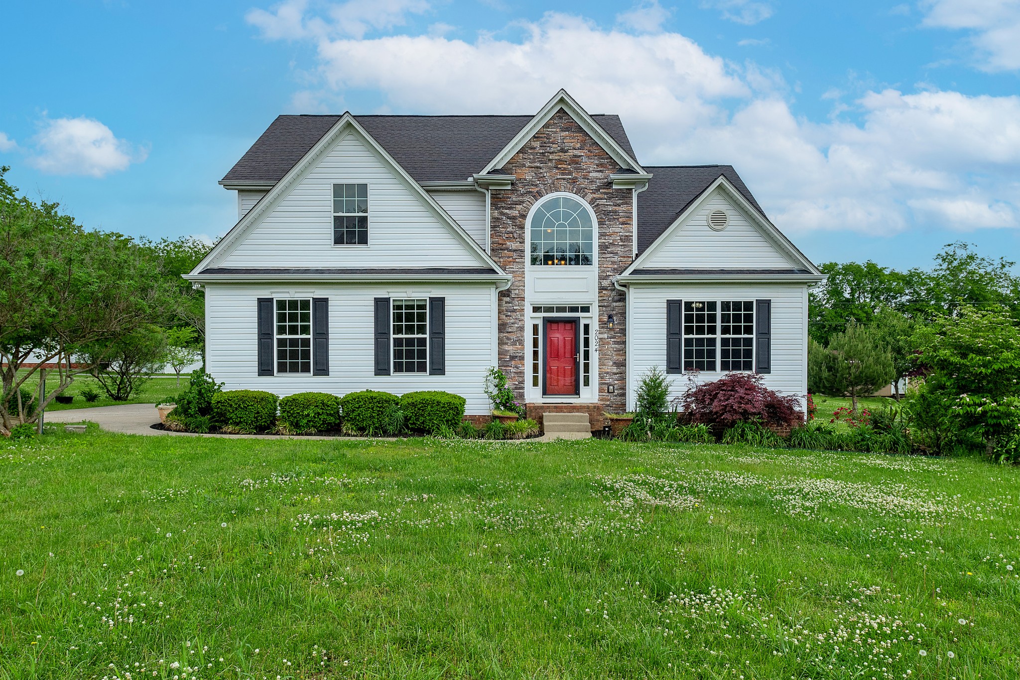 2024 Holloway Road Lebanon, TN 37090 - Photo 1 of 40 a front view of a house with a yard and garage